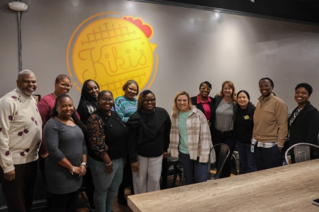 Photo of attendees at the 2025 Sip & Serve at Kiki's Chicken & Waffles